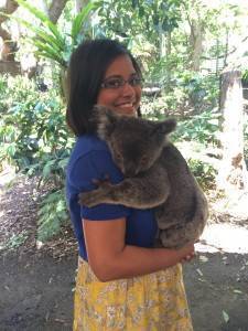 Bratati smiling and holding a koala