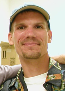 Headshot of James smiling