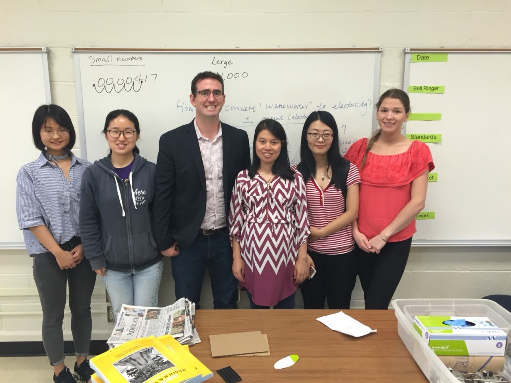 Professor Arges and Professor Zhu with students during outreach