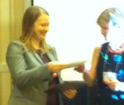  Julia Buckner receiving the Early Career Award at the ABCT Addictive Behaviors Special Interest Group meeting.