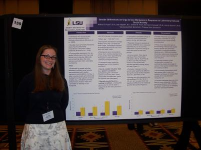 Research assistant Andrea Pusser presenting her poster.