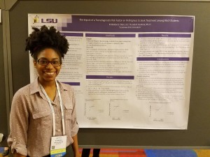 Graduate student Kimberlye Dean presenting her poster The Impact of a Transdiagnostic Risk Factor on Willingness to Seek Treatment among Black Students.