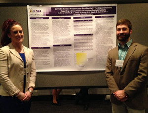 Graduate student Tony Ecker presenting research with research associate Ashley Richter