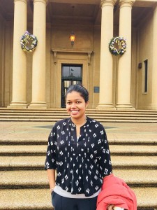 Photo of Hiruni Weerasooriya smiling in front of a building on LSU campus