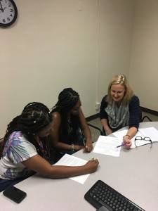 Chynna Dubuclet, Morgan Offord, and Dr. Copeland discuss research topics during one of their PDSI meetings