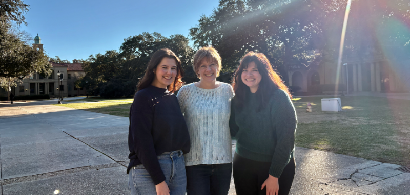 Three individuals standing outside