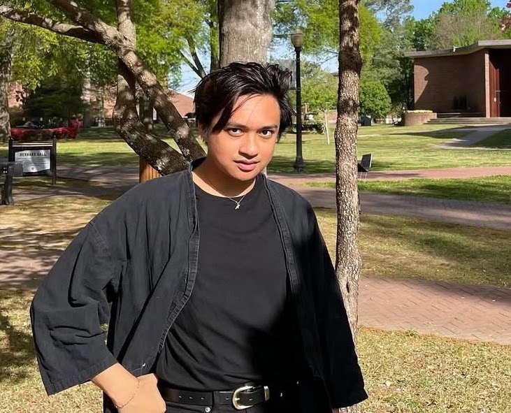 Image of a person standing outside.