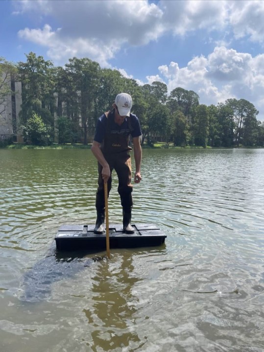 Dr. Hayes on floating platform in water