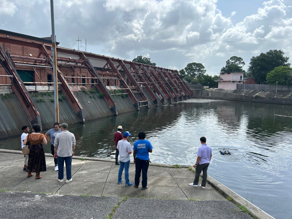 team watches blue boat mission