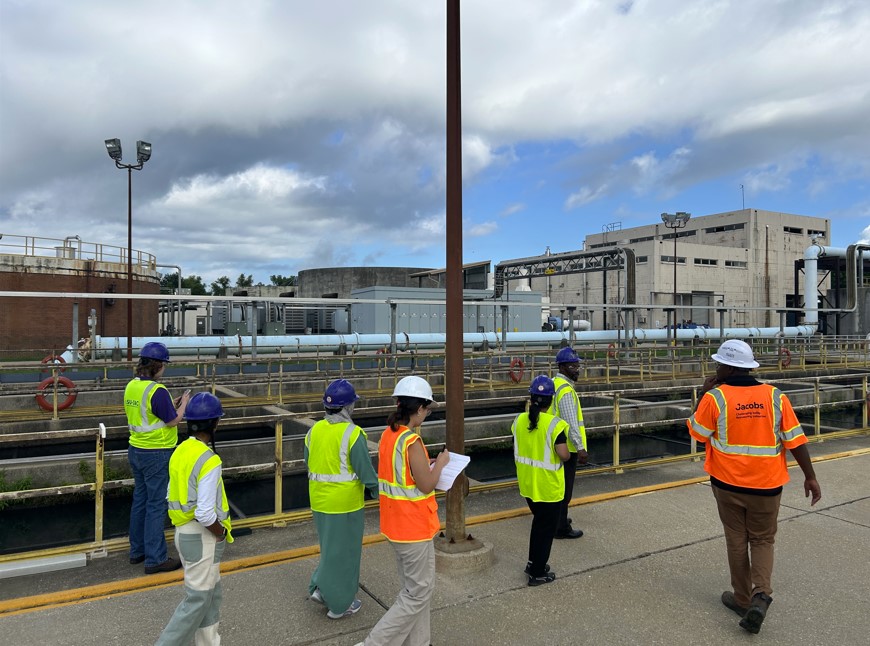 students walking around wastewater treatment plant