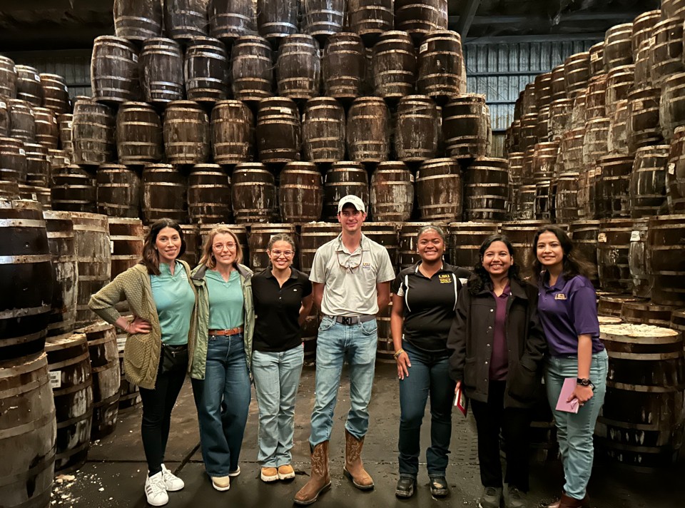 team picture in tabasco warehouse