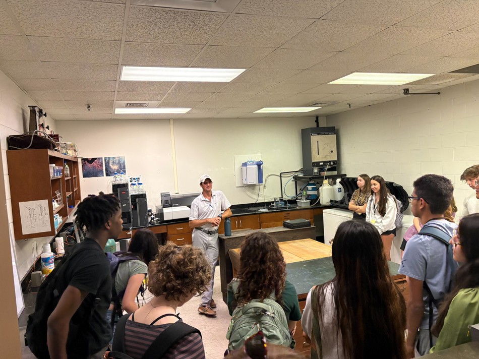 Dr. Hayes giving lab tour to students
