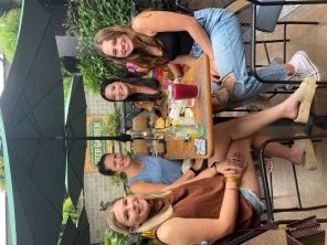 Kristen, jeanne, Jensen, and Liz at a restaurant
