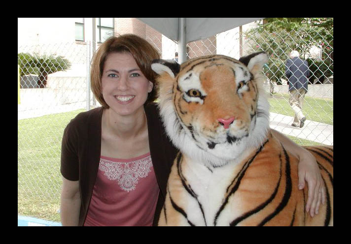 Photograph of Megan Macnaughtan and a stuffed animal Mike the Tiger