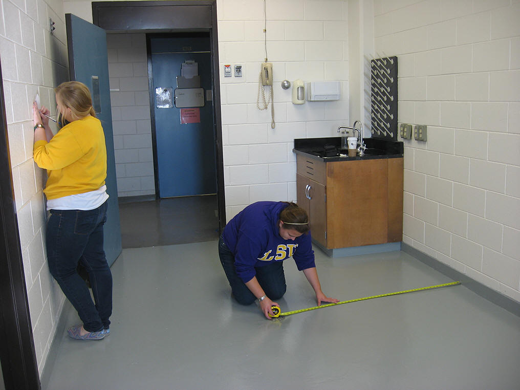 Karen Jr. & Danielle measuring the fish room