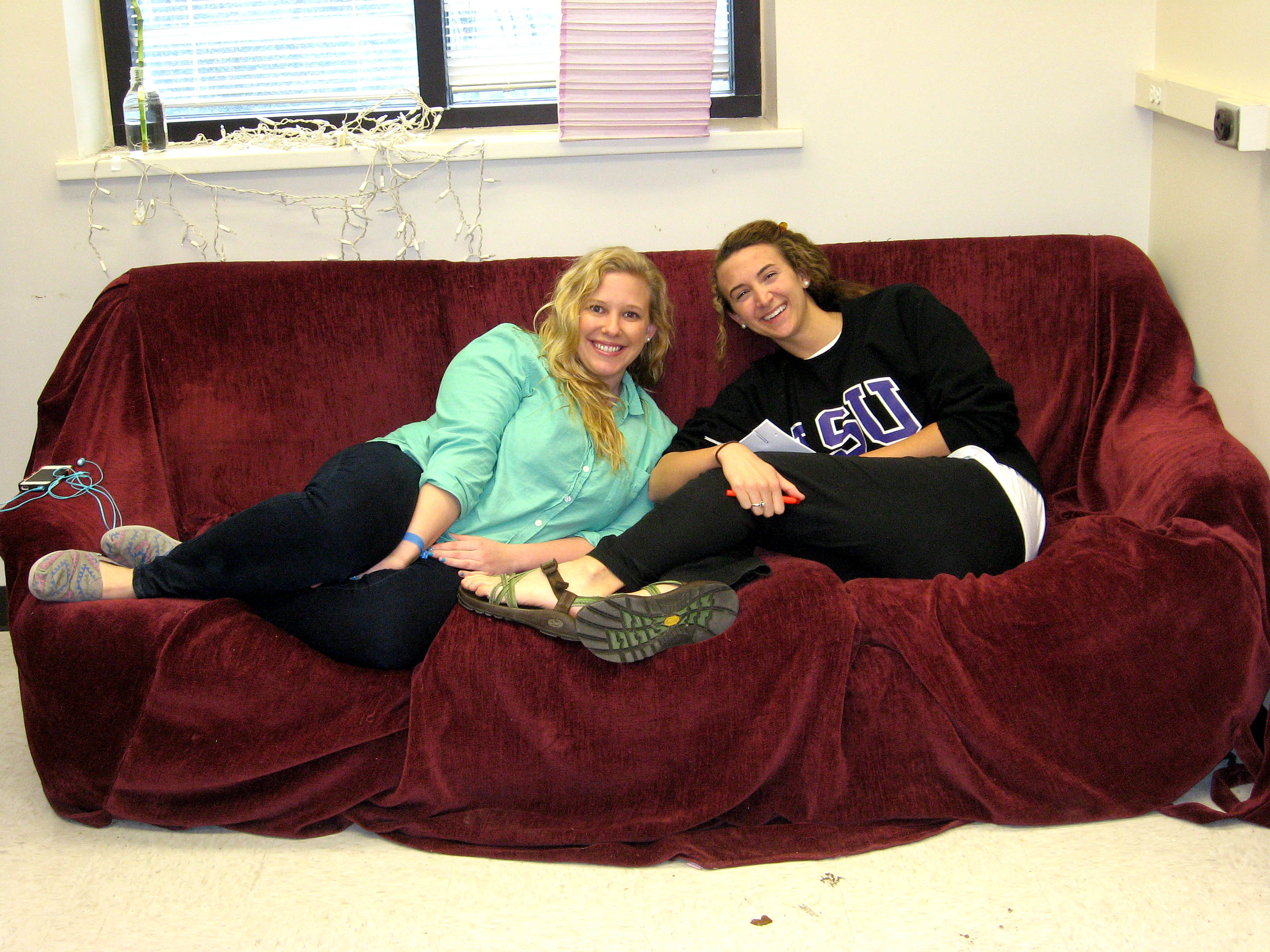 Kristi & Karen Jr. sitting on a couch