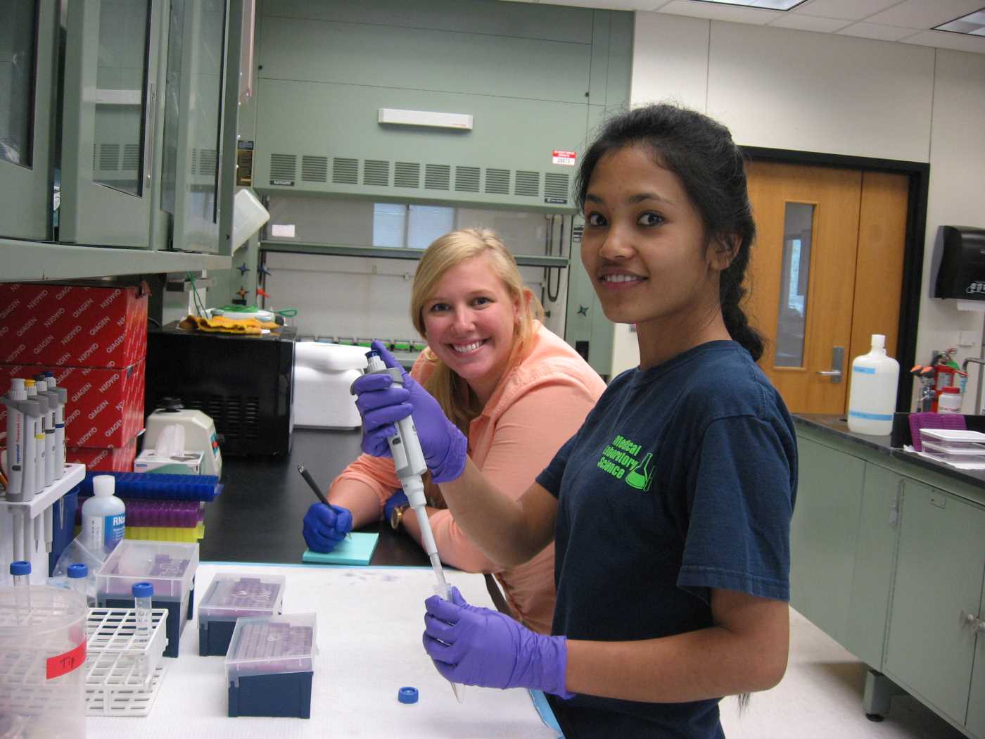 Anupa and Karen Jr. working on molecular biology
