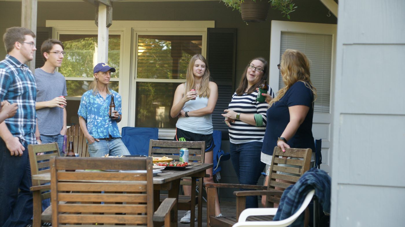 Chase, Brandon, Karen, Sarah, Julie, and Karen Jr. in Karen's backyard talking