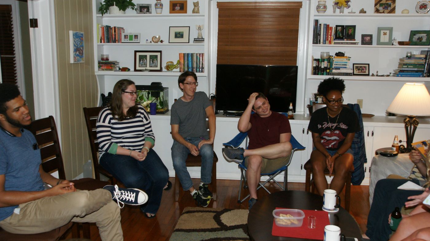 Donny, Julie, Brandon, David, and Teisha talking in a living room