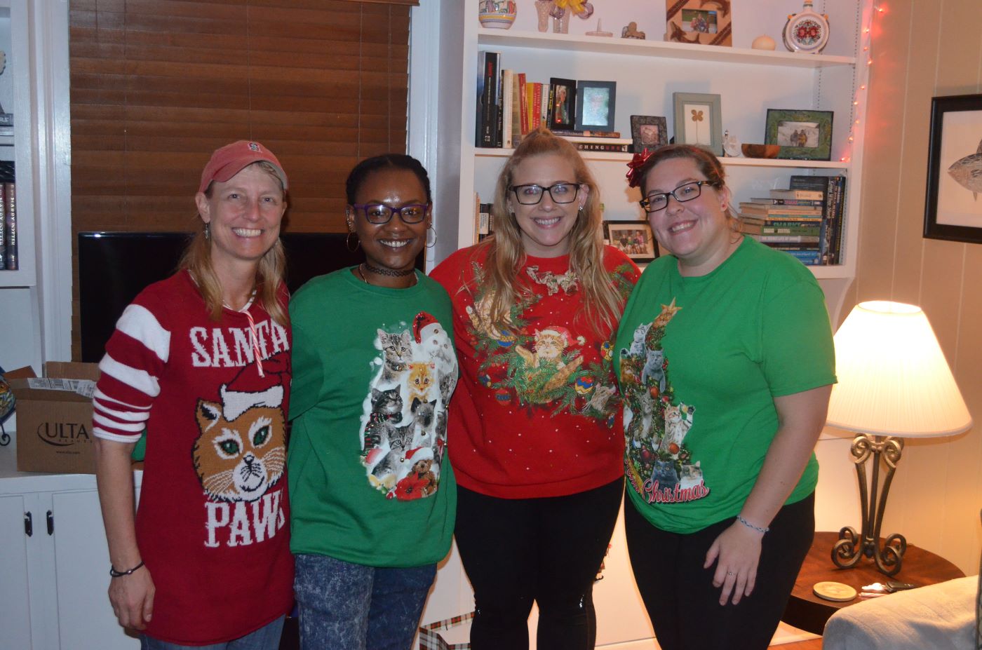 Karen with graduate students Teisha, Karen Jr., and Julie all in ugly sweaters