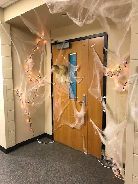 Maruska lab door covered with fake spider webs and Halloween decorations