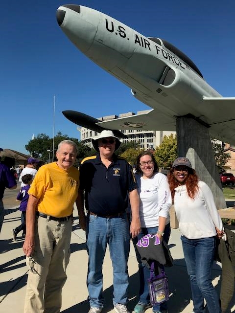Al Mensinger, Earl Weidner, Julie, and Teisha standing in front of an airplane