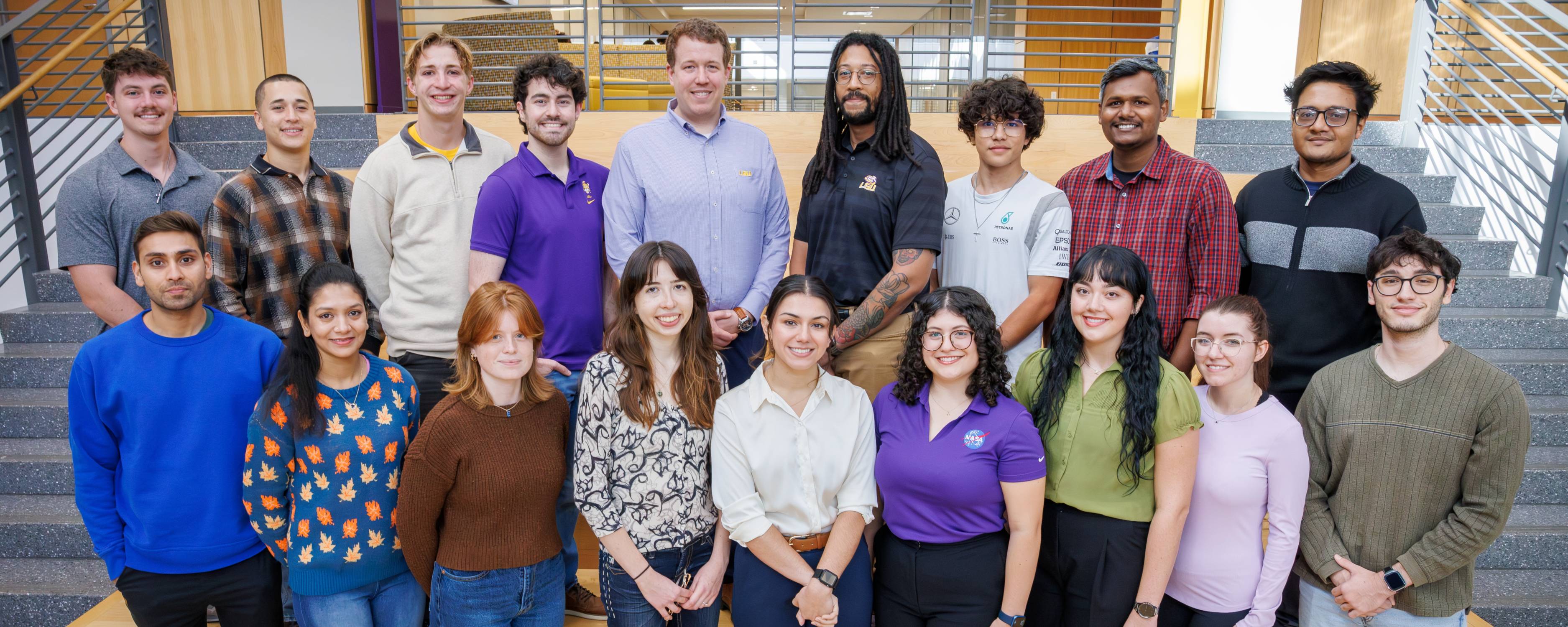 Team photo for 2025 - 2026 academic year, showing the team standing on the Capstone stairs.
