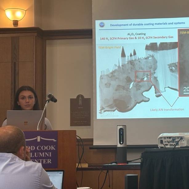 Sam Murillo presents slide on TEM imaging at CISIA conference.