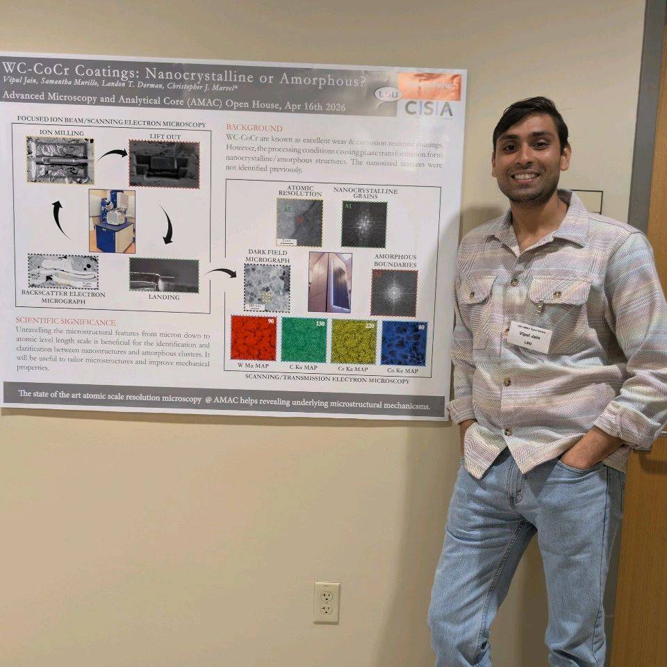 Vipul in front of his poster for the AMAC open house.