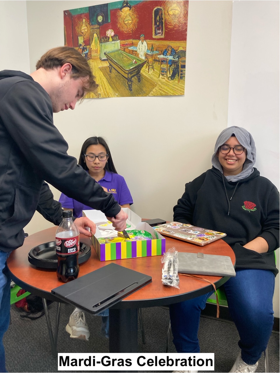 Mardi-Gras Celebration: Briggs is cutting Mardi-Gras cake