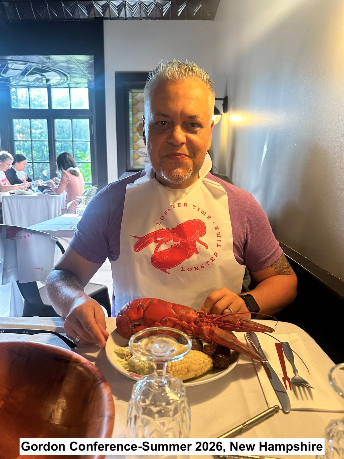 Dr. Moreira is eating a huge lobster at Gordon conference