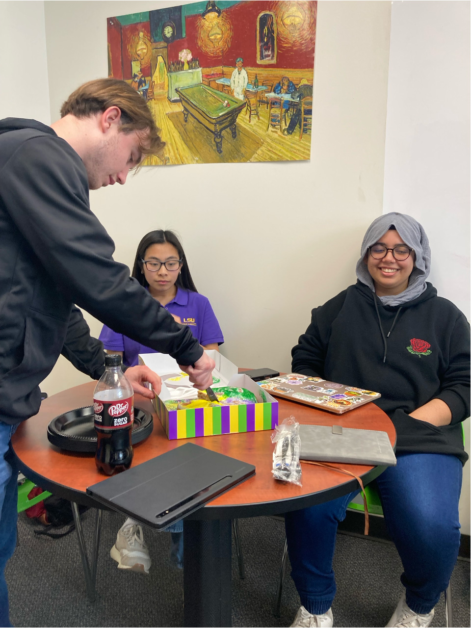 Three students are going to have a King Cake