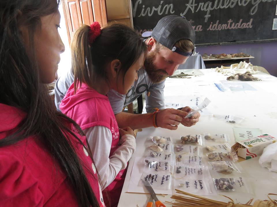 Jacob teaching students in Peru about shells