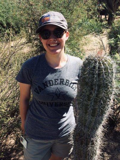photo of Nina Susich standing next to a cactus
