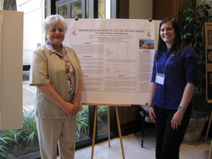 Violet Ragusa and Pam Forest in front of poster board