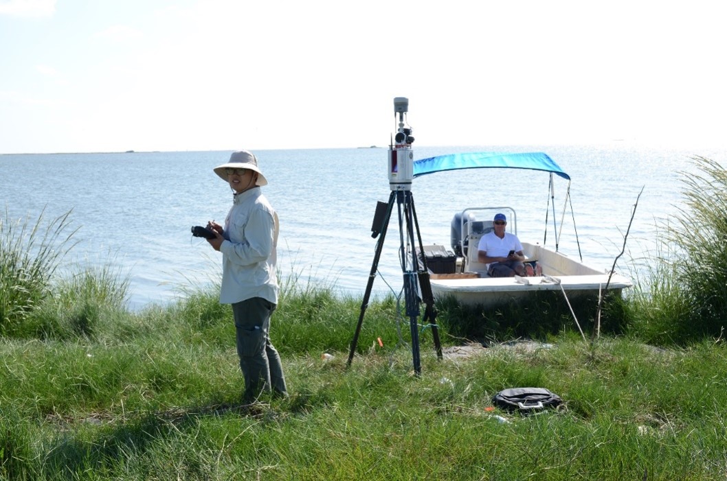 Xukai Zhang was conducting terrestrial LiDAR survey for the wetland restoration project