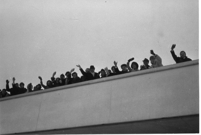 group of people waving