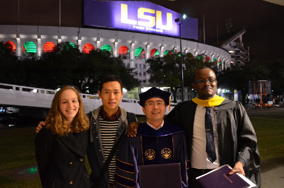 Hilary Eikhuemelo (Master) and Jianqing Zhao (Ph.D.) Graduation. Left to Right: Sarah Ellis, Andrew Xie, Jianqing Zhao, Hiliary Eikhuemelo