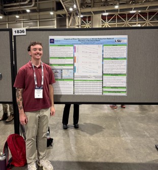 jey standing by poster