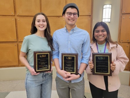 students holding awards