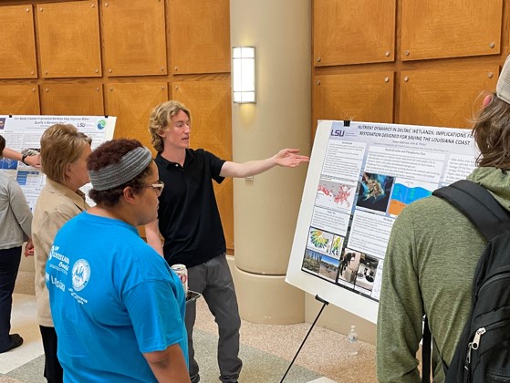 james explaining research poster