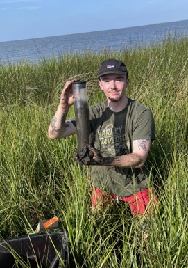 jey holding soil core