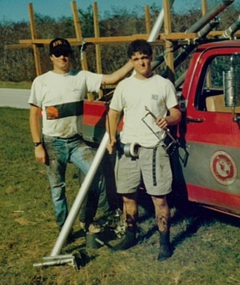 john and randy standing by truck