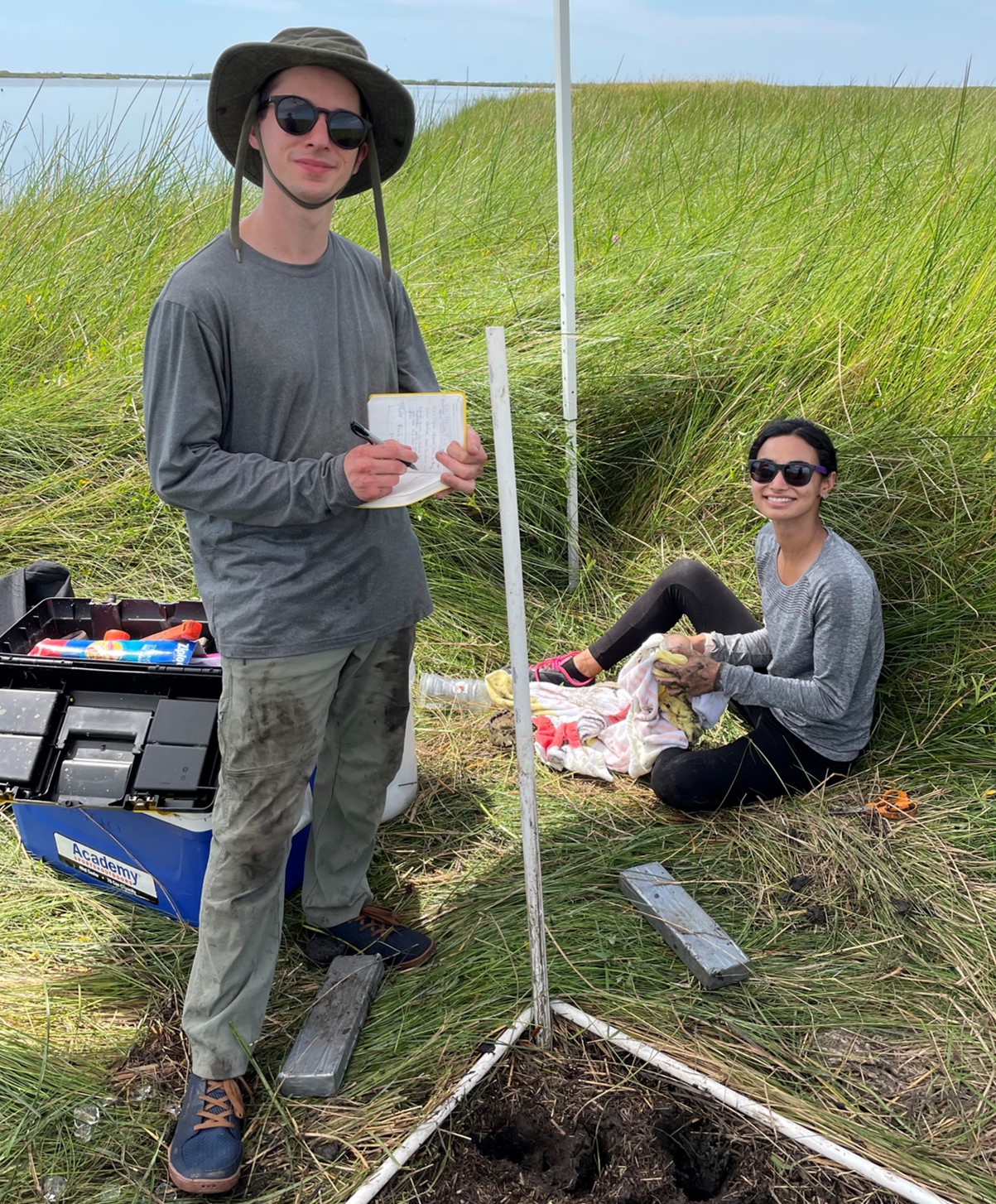 students standing in marsh